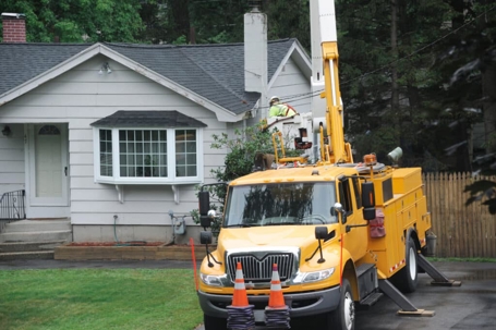 Service truck in front of a house