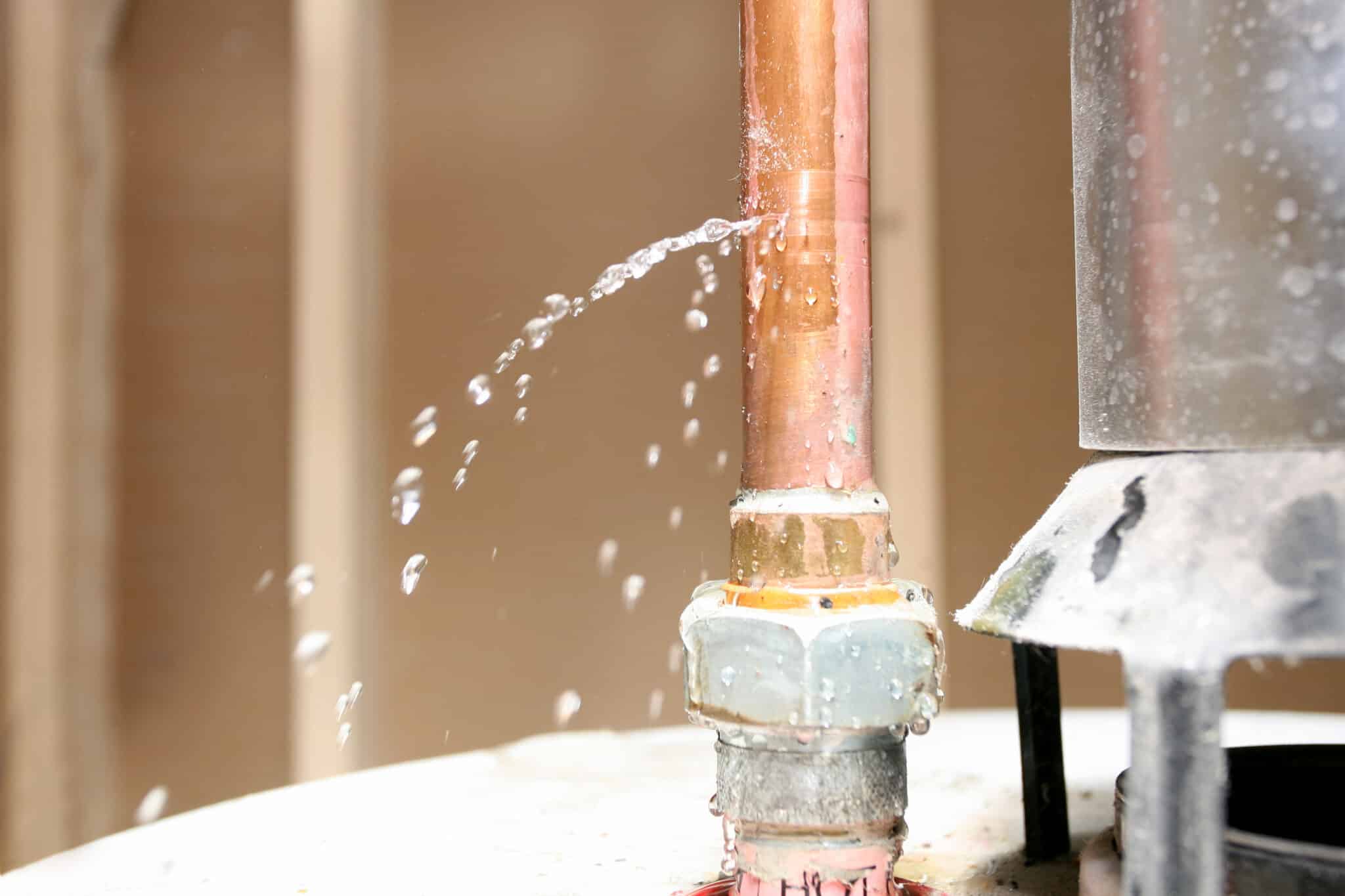 Water leaking out of a pipe on top of a water heater, Cold weather water heater problems.